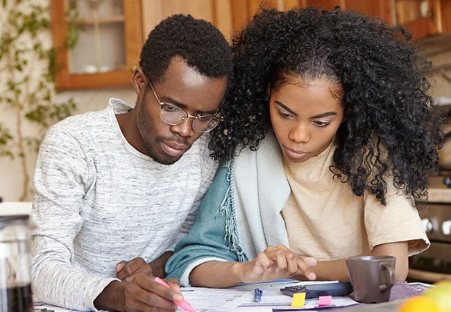 Young Couple reviewing their insurance needs