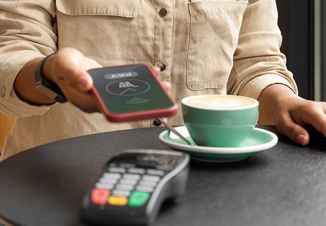 Customer paying for their coffee